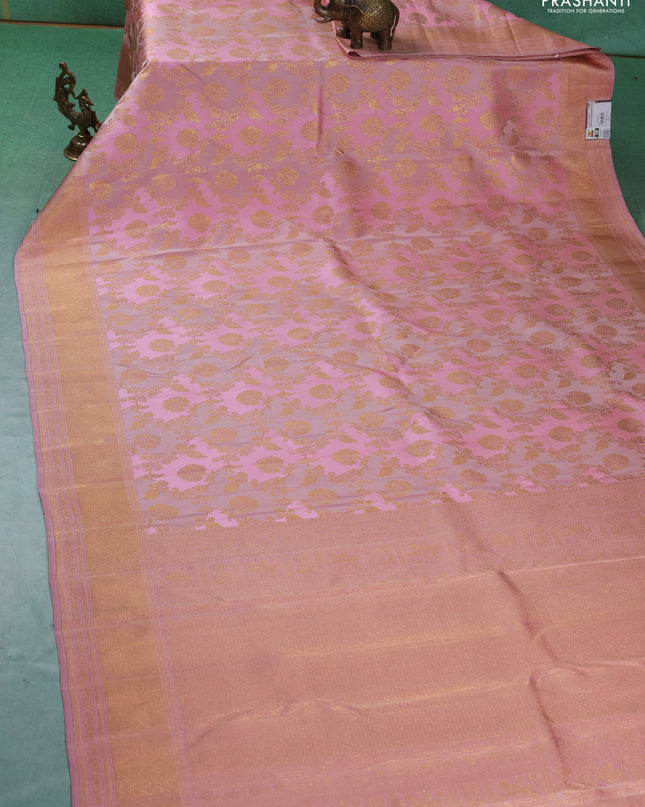 Pure kanchipuram silk saree pastel pink with allover zari woven floral weaves and zari woven border