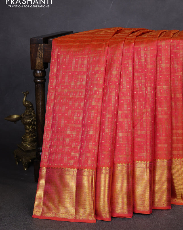 Pure kanchipuram silk saree dual shade of pinkish orange with allover zari checks & buttas and zari woven border