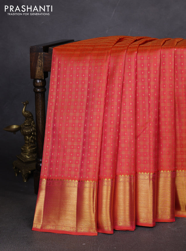 Pure kanchipuram silk saree dual shade of pinkish orange with allover zari checks & buttas and zari woven border