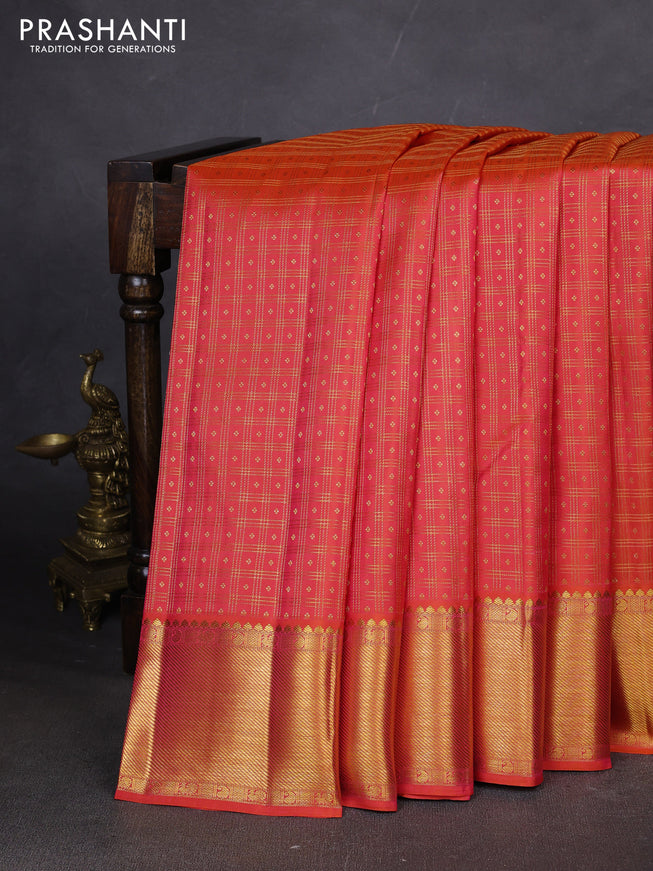 Pure kanchipuram silk saree dual shade of pinkish orange with allover zari checks & buttas and zari woven border