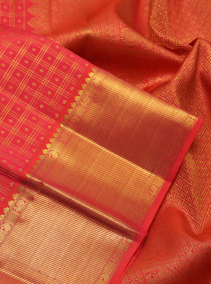 Pure kanchipuram silk saree dual shade of pinkish orange with allover zari checks & buttas and zari woven border