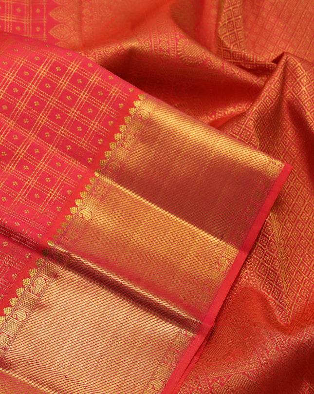 Pure kanchipuram silk saree dual shade of pinkish orange with allover zari checks & buttas and zari woven border