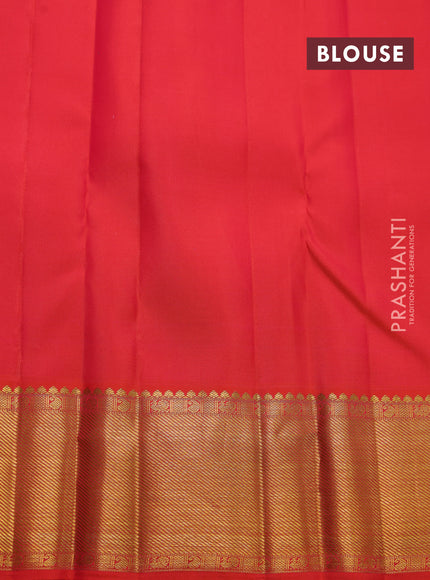 Pure kanchipuram silk saree dual shade of pinkish orange with allover zari checks & buttas and zari woven border