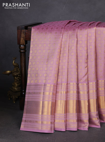Pure kanchipuram silk saree pastel pink with allover zari checks & buttas and long zari woven border