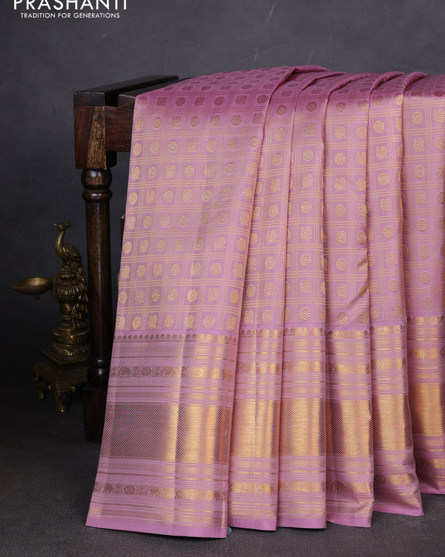 Pure kanchipuram silk saree pastel pink with allover zari checks & buttas and long zari woven border
