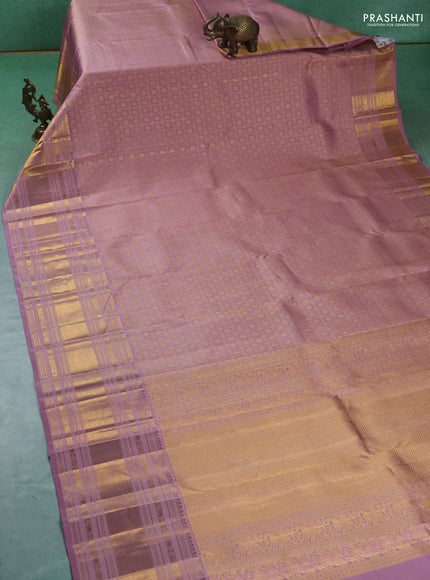 Pure kanchipuram silk saree pastel pink with allover zari checks & buttas and long zari woven border