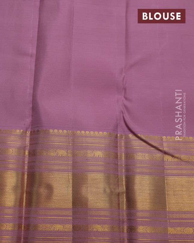 Pure kanchipuram silk saree pastel pink with allover zari checks & buttas and long zari woven border
