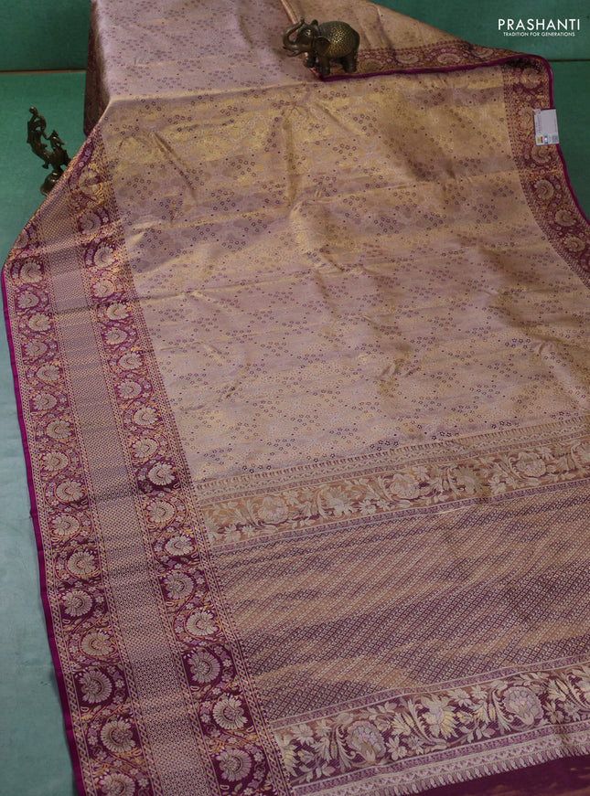 Pure kanchipuram tissue silk saree mild peach and purple with allover zari woven brocade weaves and long zari woven border