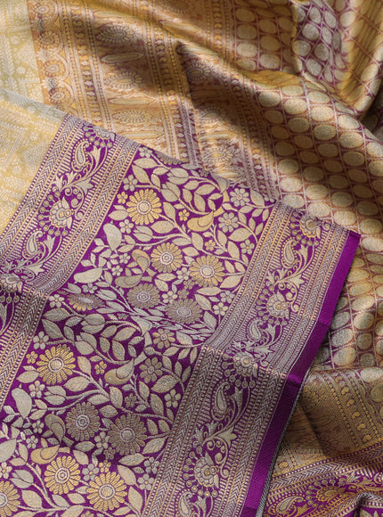 Pure kanchipuram tissue silk saree cream and purple with allover zari woven brocade weaves and long zari woven border