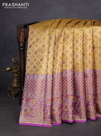 Pure kanchipuram tissue silk saree gold and lavender with allover zari woven brocade weaves and long zari woven border