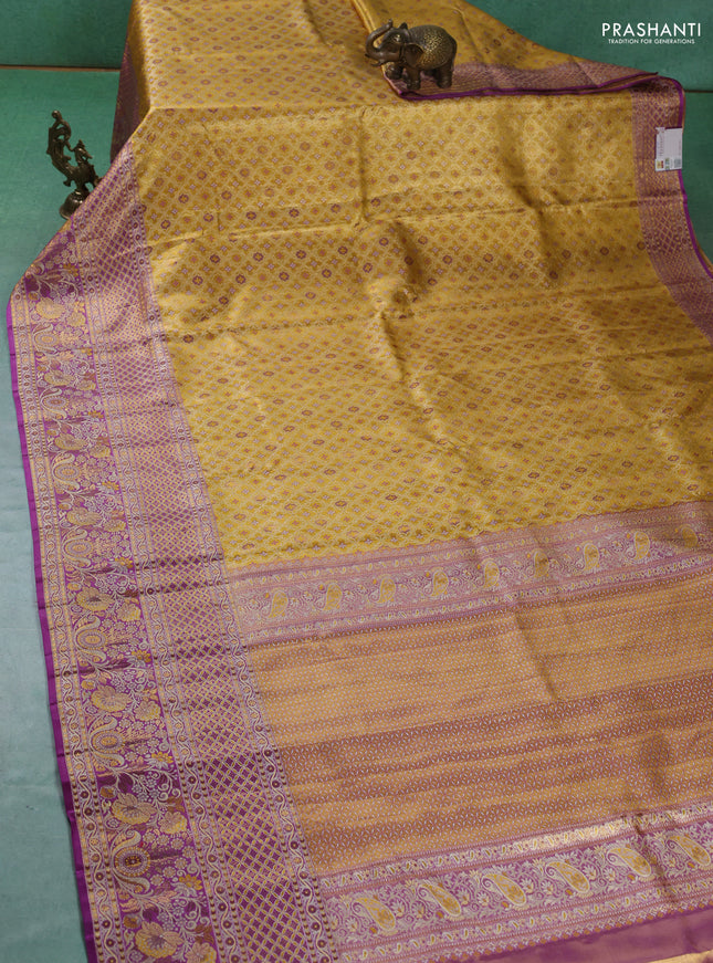 Pure kanchipuram tissue silk saree gold and lavender with allover zari woven brocade weaves and long zari woven border