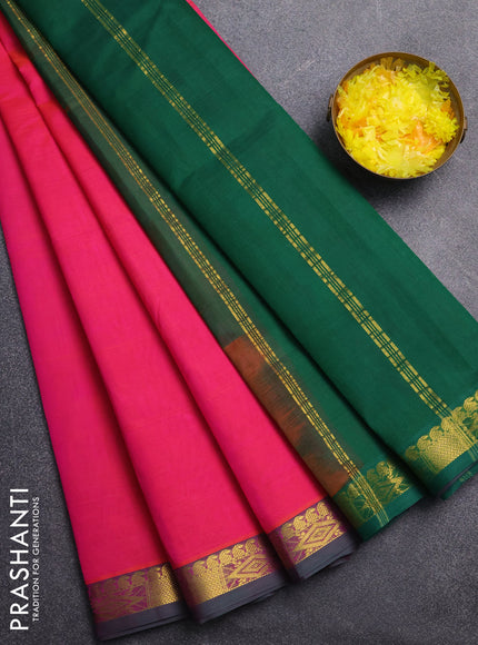 Silk cotton saree pink and green with plain body and zari woven border