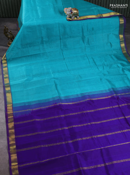 Silk cotton saree teal blue and blue with plain body and zari woven border