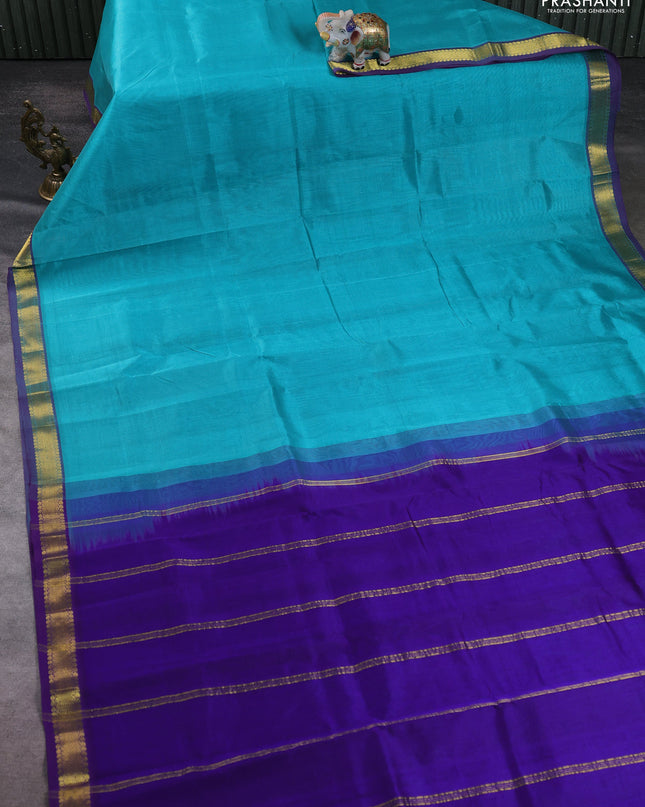 Silk cotton saree teal blue and blue with plain body and zari woven border
