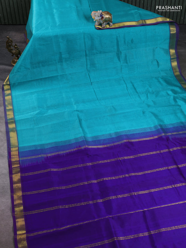Silk cotton saree teal blue and blue with plain body and zari woven border
