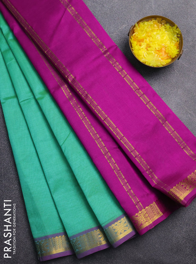 Silk cotton saree green and purple with plain body and zari woven border