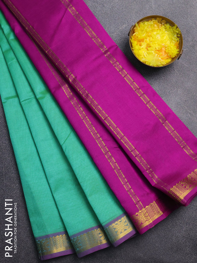Silk cotton saree green and purple with plain body and zari woven border