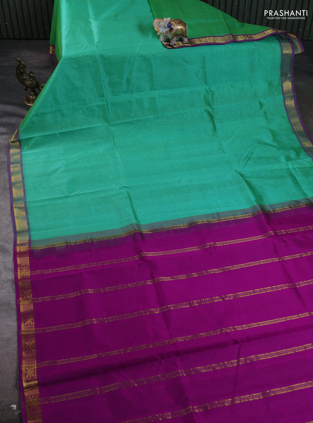 Silk cotton saree green and purple with plain body and zari woven border