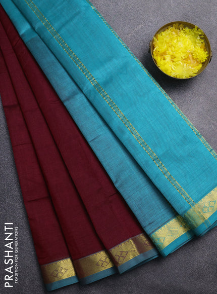 Silk cotton saree maroon and teal blue with plain body and zari woven border