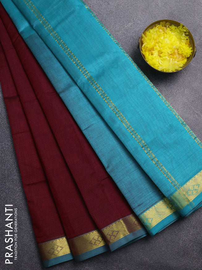 Silk cotton saree maroon and teal blue with plain body and zari woven border
