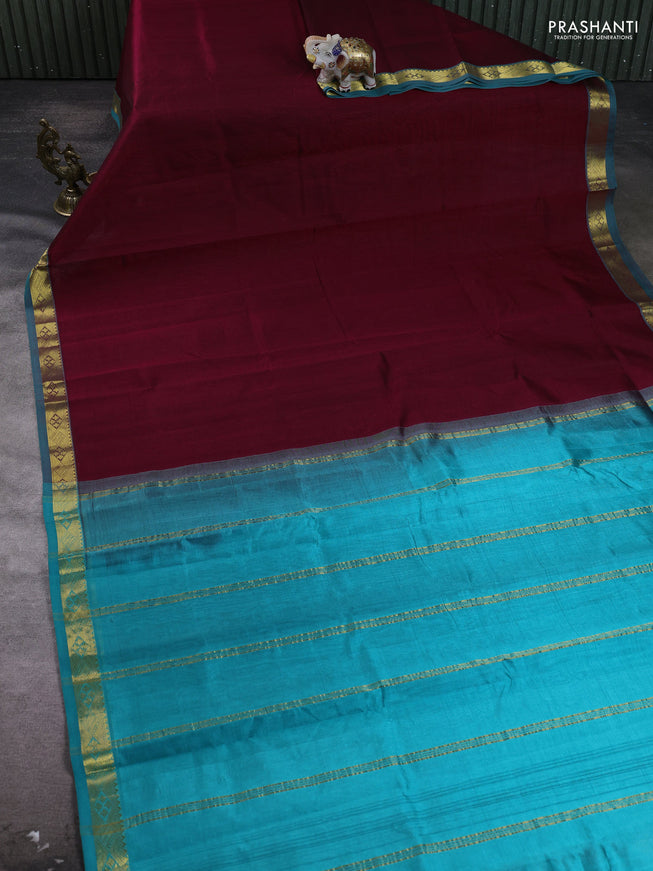 Silk cotton saree maroon and teal blue with plain body and zari woven border