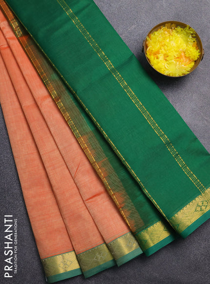 Silk cotton saree pale orange and green with plain body and zari woven border