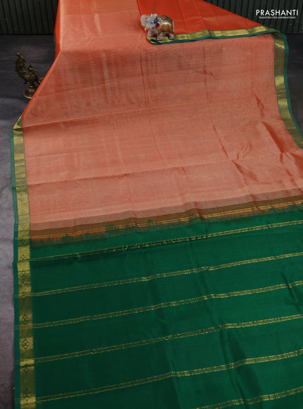 Silk cotton saree pale orange and green with plain body and zari woven border