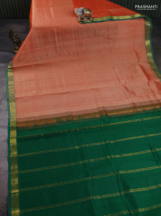Silk cotton saree pale orange and green with plain body and zari woven border