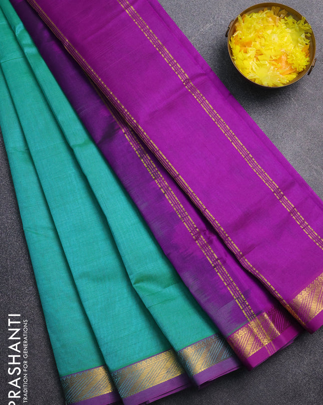 Silk cotton saree teal green and purple with plain body and zari woven border
