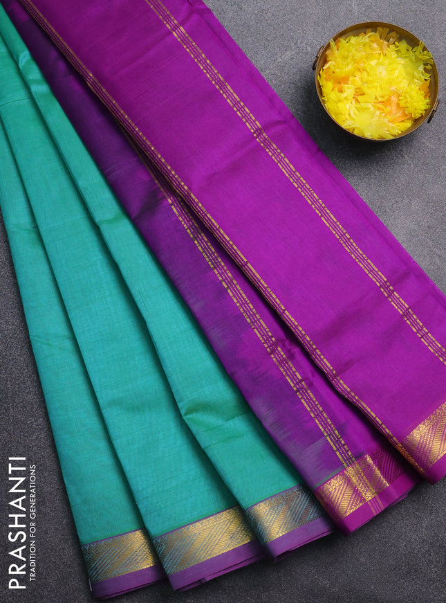 Silk cotton saree teal green and purple with plain body and zari woven border