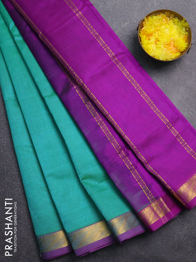 Silk cotton saree teal green and purple with plain body and zari woven border