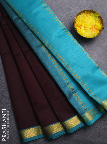 Silk cotton saree coffee brown and teal green with plain body and zari woven border