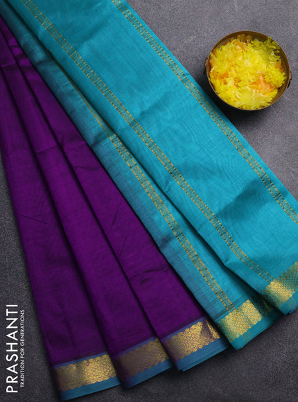 Silk cotton saree purple and teal green with plain body and zari woven border