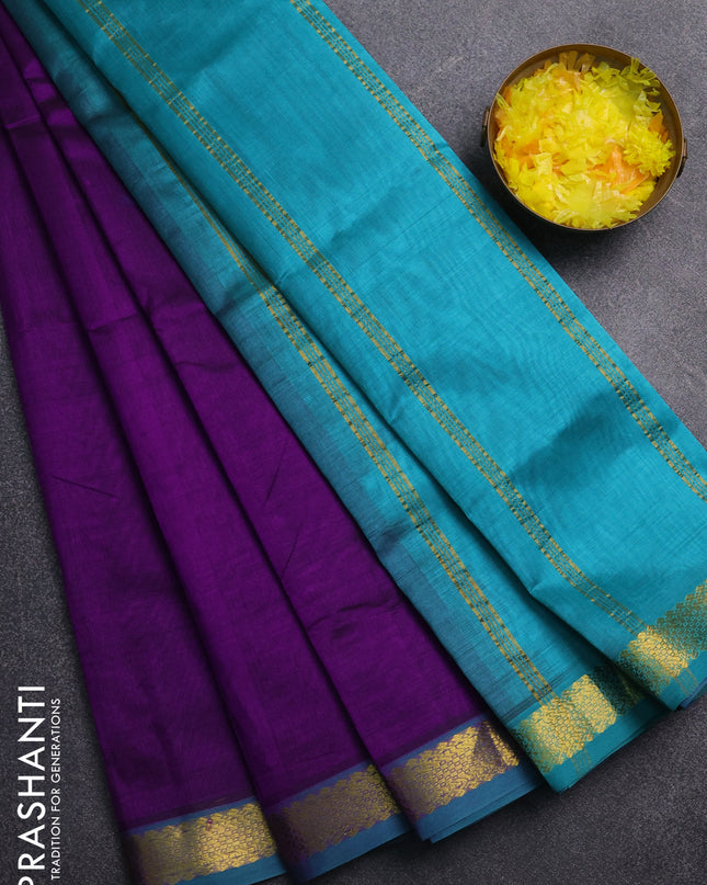 Silk cotton saree purple and teal green with plain body and zari woven border