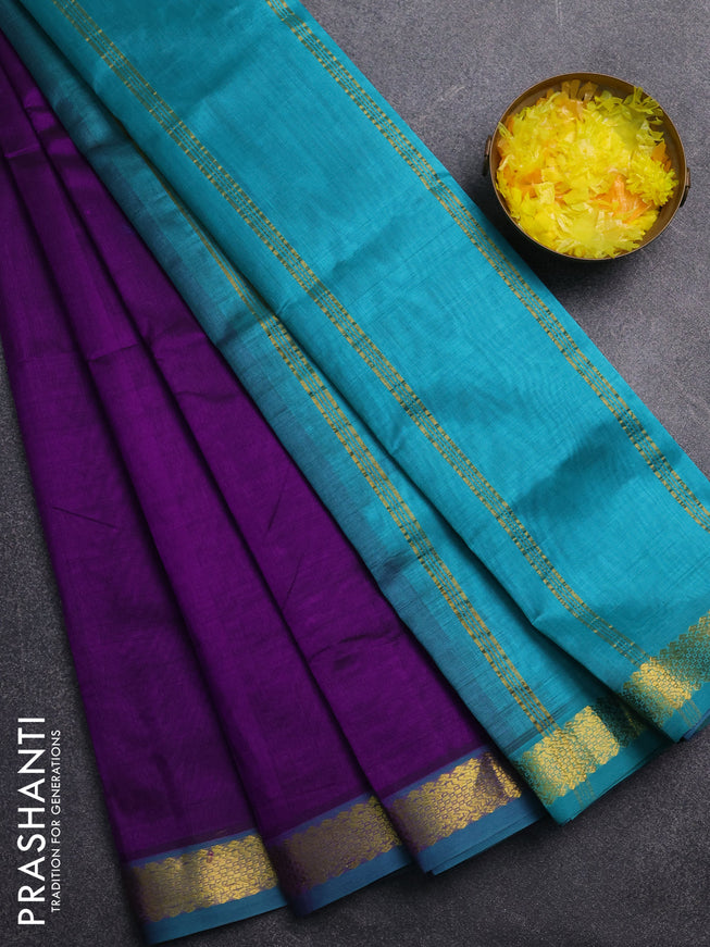 Silk cotton saree purple and teal green with plain body and zari woven border