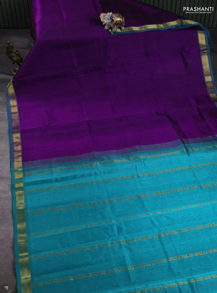 Silk cotton saree purple and teal green with plain body and zari woven border