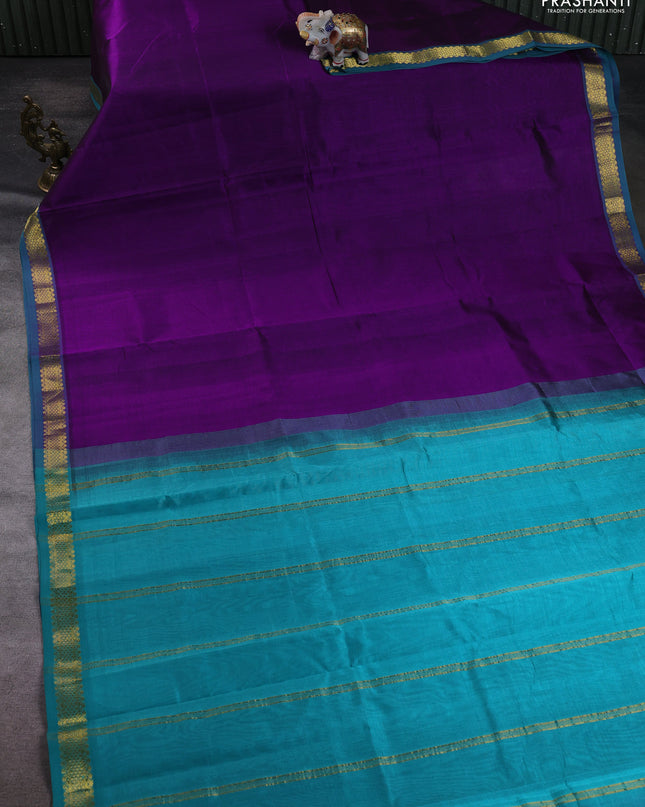 Silk cotton saree purple and teal green with plain body and zari woven border