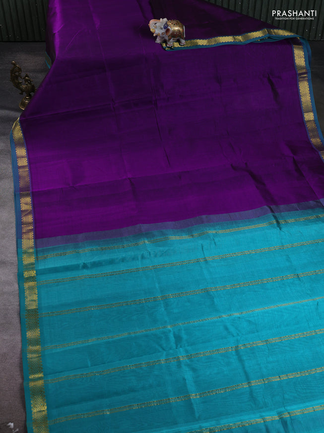 Silk cotton saree purple and teal green with plain body and zari woven border