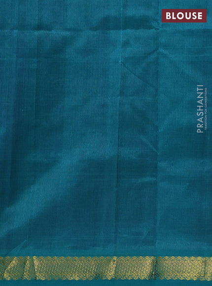 Silk cotton saree purple and teal green with plain body and zari woven border