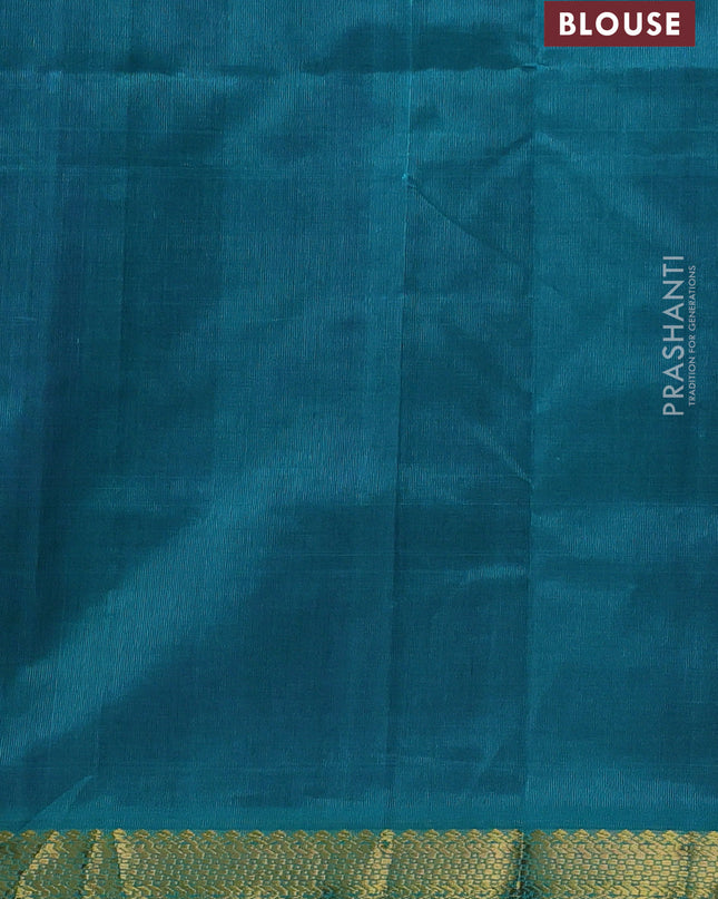 Silk cotton saree purple and teal green with plain body and zari woven border