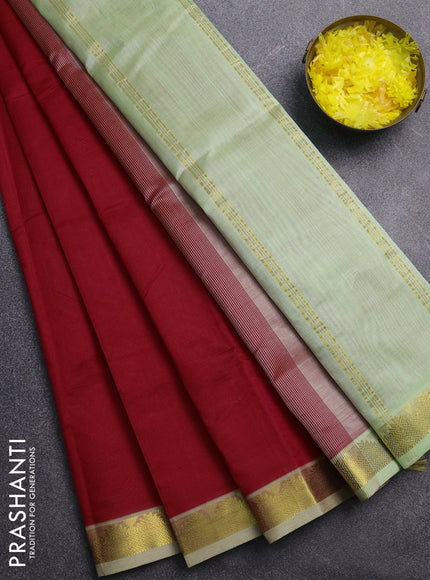 Silk cotton saree red and pista green with plain body and zari woven border