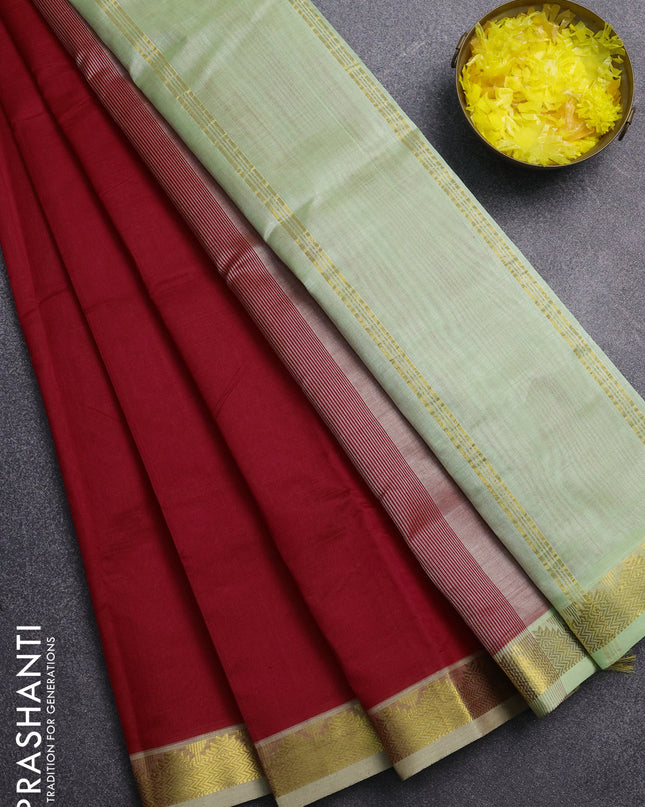 Silk cotton saree red and pista green with plain body and zari woven border