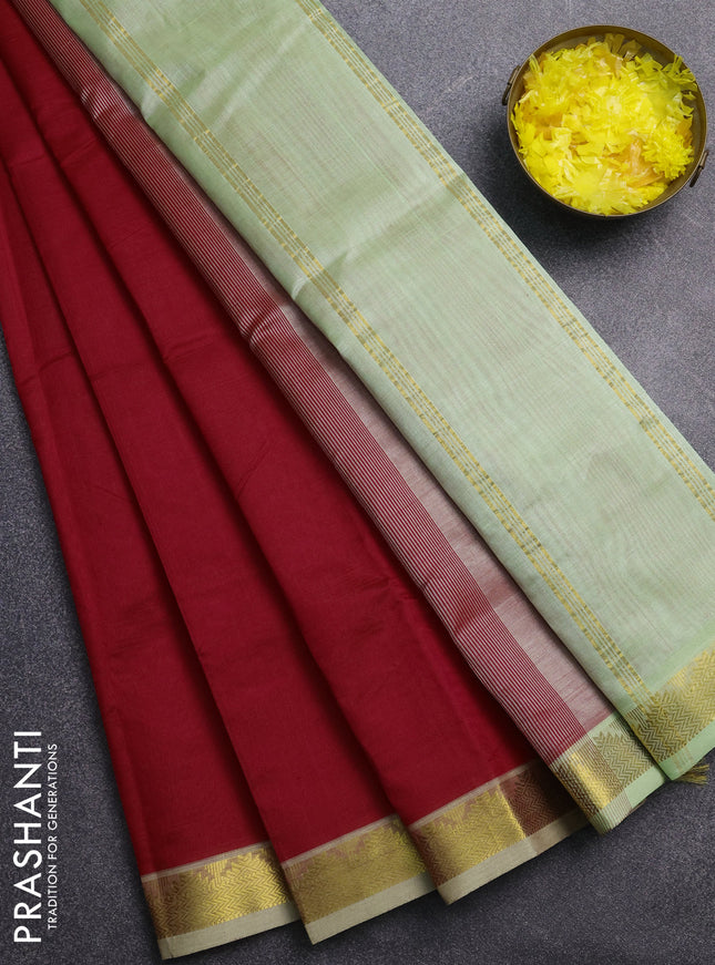 Silk cotton saree red and pista green with plain body and zari woven border
