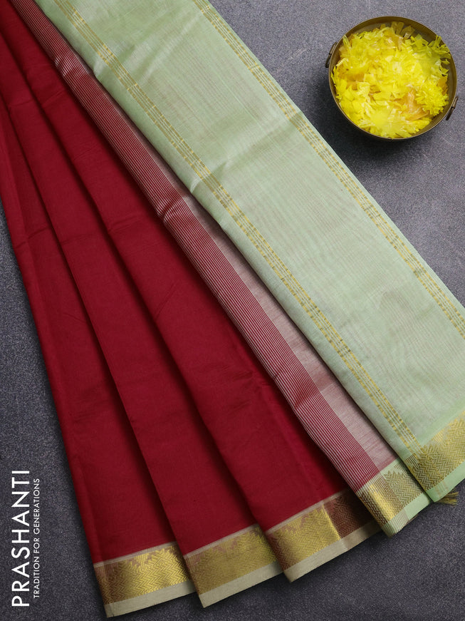 Silk cotton saree red and pista green with plain body and zari woven border