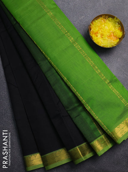 Silk cotton saree black and green with plain body and zari woven border