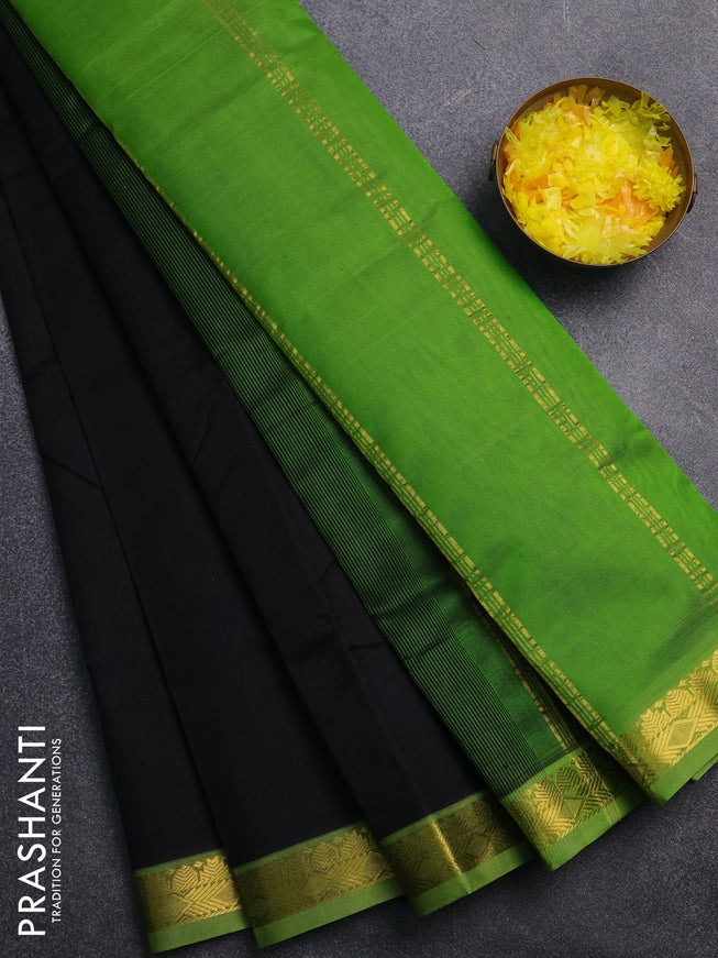Silk cotton saree black and green with plain body and zari woven border