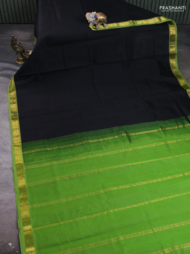 Silk cotton saree black and green with plain body and zari woven border