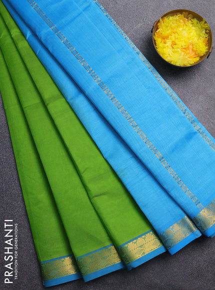 Silk cotton saree light green and cs blue with plain body and zari woven border