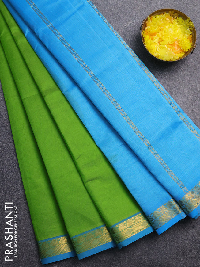 Silk cotton saree light green and cs blue with plain body and zari woven border