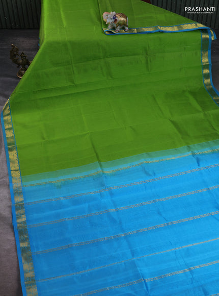 Silk cotton saree light green and cs blue with plain body and zari woven border